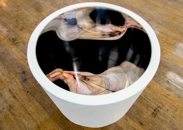 Clark's photography features contorted reflections of the human body to help raise awareness of her heart condition. Picture: Contributed
