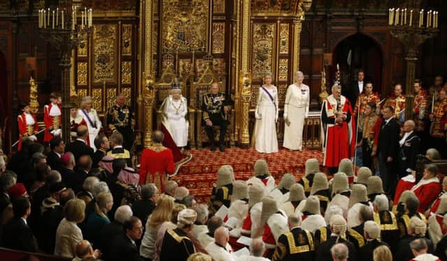 The Queen and the Duke of Edinburgh sit during the state opening of parliament in the House of Lords. Picture: PA