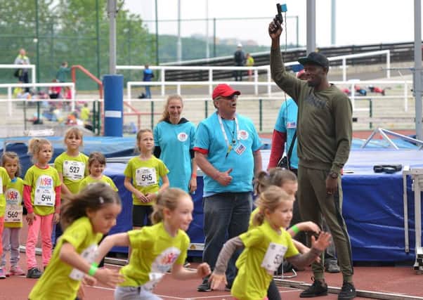 Jamaican sprinter Usain Bolt starts a children's track and field meeting in Prague. Picture: Michal Cizek/AFP/Getty