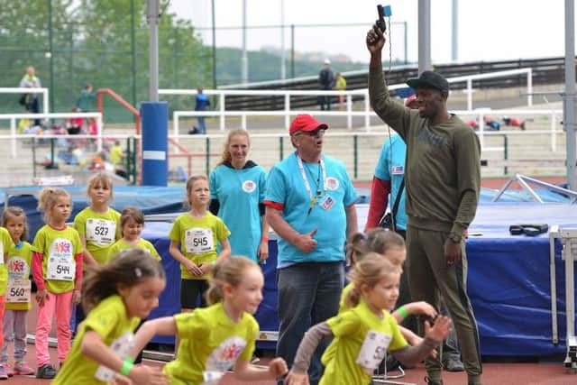 Jamaican sprinter Usain Bolt starts a children's track and field meeting in Prague. Picture: Michal Cizek/AFP/Getty
