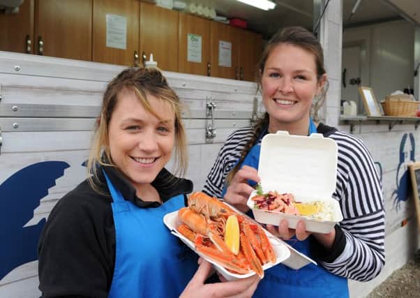 Fenella MacRae (left) and Kirsty Scobie with some of the produce being served at their Seafood Shack. Picture: SWNS