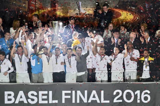 The Sevilla players celebrate with the trophy after their 3-1 win over Liverpool in the Europa League final. Picture: AFP/Getty Images