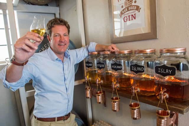 Marcus Pickering raises a glass to the distiller's range of oak-aged gins. Picture: Ian Georgeson