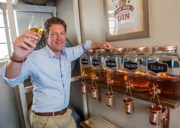 Marcus Pickering raises a glass to the distiller's range of oak-aged gins. Picture: Ian Georgeson
