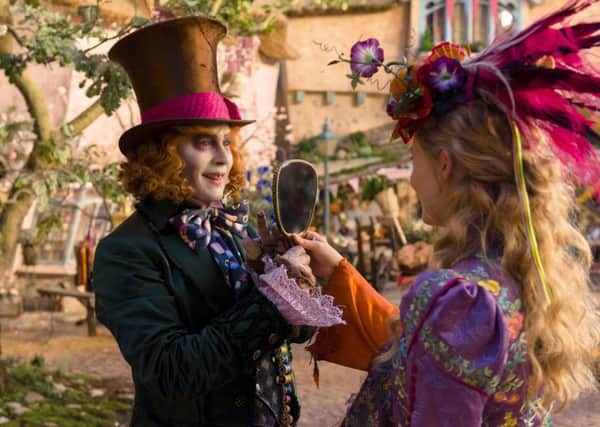 Mia Wasikowska, right, as Alice and Johnny Depp as The Mad Hatter