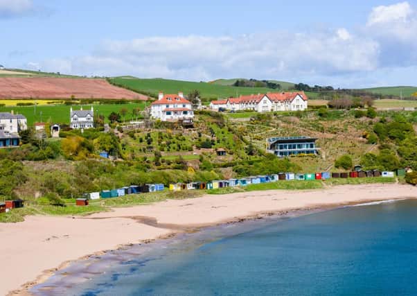 The spectacular setting of Dunlaverock House above Coldingham Sands. Its stepped garden leads down to the beach.