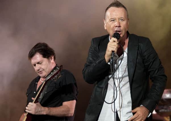Simple Minds' vocalist Jim Kerr (right) performs with guitarist Charlie Burchill. Picture: AFP/GettyImages