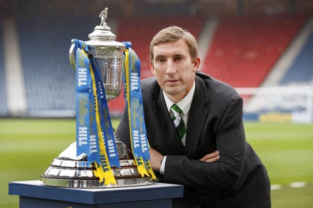 Hibernian manager Alan Stubbs poses with the Scottish Cup. Picture: Steve Welsh