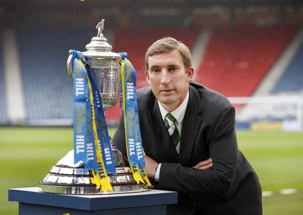 Hibernian manager Alan Stubbs poses with the Scottish Cup. Picture: Steve Welsh
