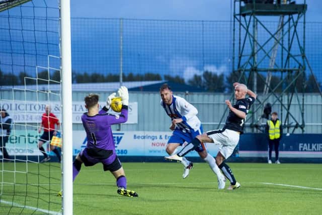 Falkirk goalkeeper Danny Rogers saves Kris Boyd's header. Picture: SNS.