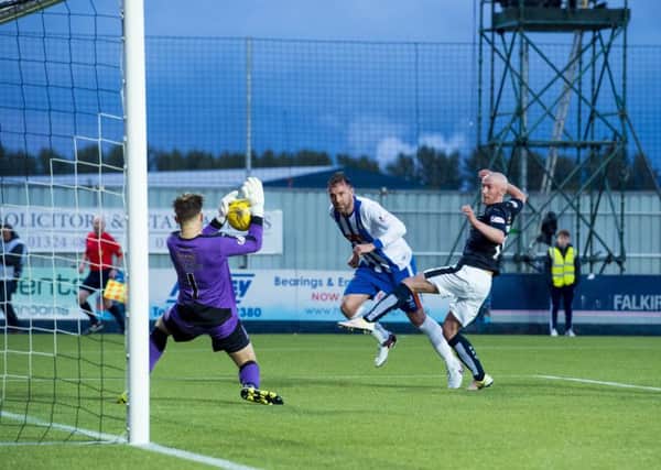 Falkirk goalkeeper Danny Rogers saves Kris Boyd's header. Picture: SNS.