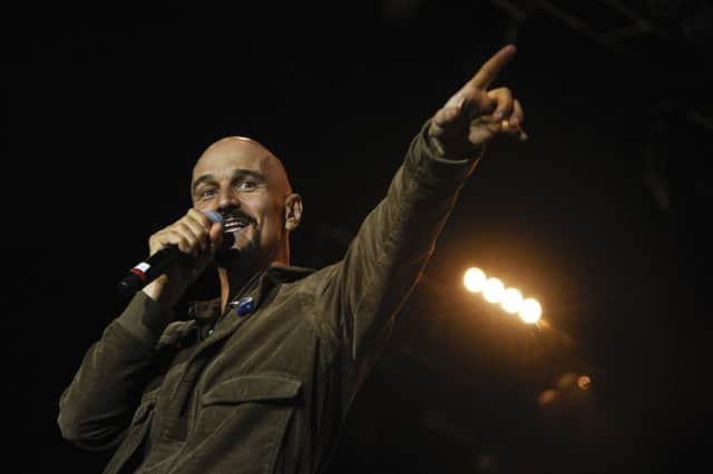 James frontman Tim Booth dabbled in crowd-surfing. Picture: AFP/Getty