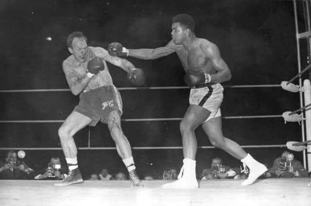 1966: Cassius Clay (later Muhammad Ali) beat Henry Cooper to retain world heavyweight boxing title. Picture: Getty