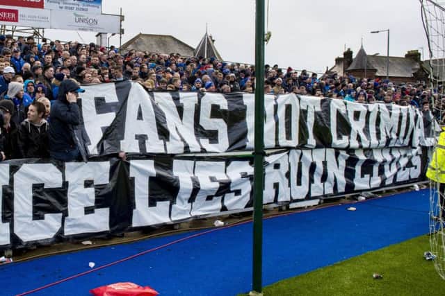 Rangers fans unveil a banner at a game against Queen of the South. Picture: SNS