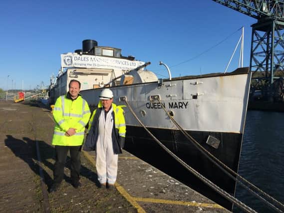 Friends of Queen Mary trustees Iain Sim (left) and Calum Bryce by the steamer they helped return to the Clyde. Picture: Ross Easton
