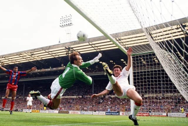 Jim Leighton and Steve Bruce are unable to prevent Crystal Palace's first goal in the 1990 FA Cup final. Picture: Getty.