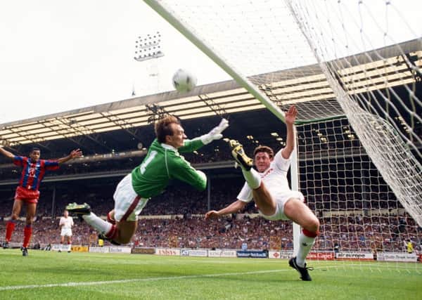 Jim Leighton and Steve Bruce are unable to prevent Crystal Palace's first goal in the 1990 FA Cup final. Picture: Getty.