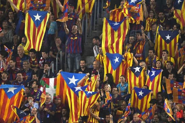 Barcelona fans wave Estelada flags during a match. Picture: Getty Images