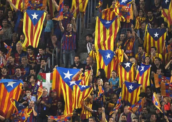Barcelona fans wave Estelada flags during a match. Picture: Getty Images
