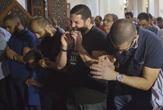 Mourners in Cairo at special prayer meetings to commemorate the missing as air and sea searches continue over hundreds of square miles of the Mediterranean. Picture: AP