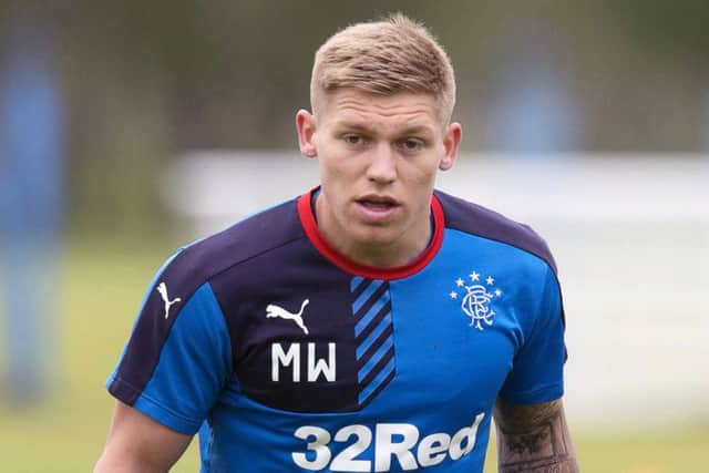 Martyn Waghorn will look to get the better of Paul Hanlon. Picture: SNS