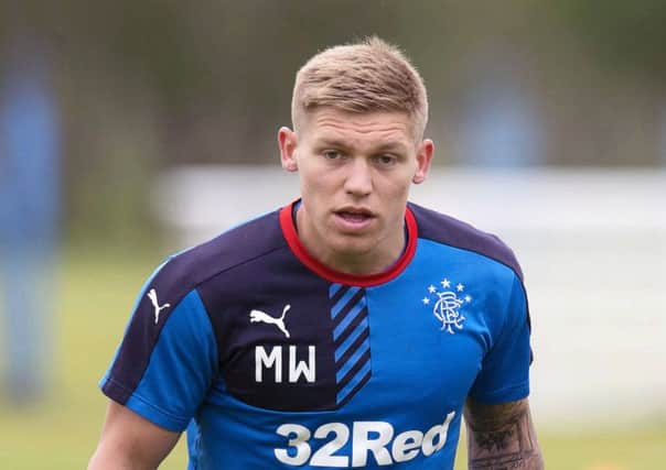 Martyn Waghorn will look to get the better of Paul Hanlon. Picture: SNS