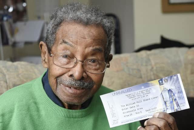 106-year-old Hibs fan Sam Martinez with his Cup final ticket. Picture: Greg Macvean