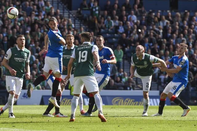 Hibernian's David Gray (second from right) scores the winner. Picture: SNS