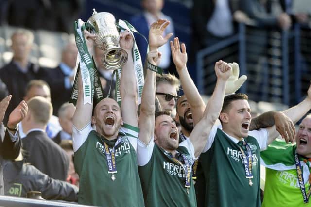Hibs captain David Gray lifts the Scottish Cup. Picture: Neil Hanna