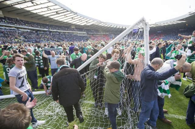 The Hampden crossbar was a casualty as Hibs fans invaded the pitch after the Scottish Cup final win. Picture: Jeff Holmes/PA Wire