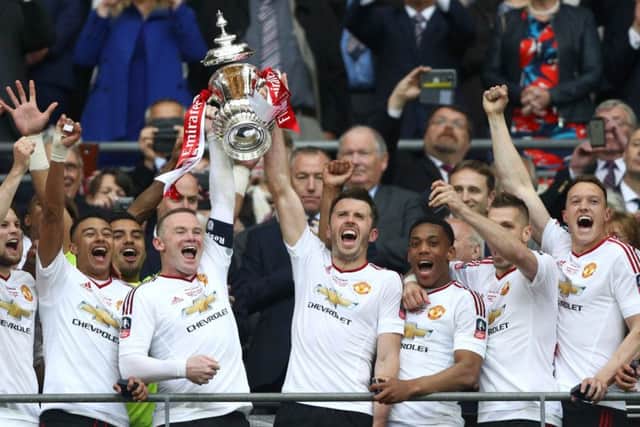 Manchester United captain Wayne Rooney got his hands on the FA Cup for the first time in his career.  Picture: Paul Gilham/Getty Images