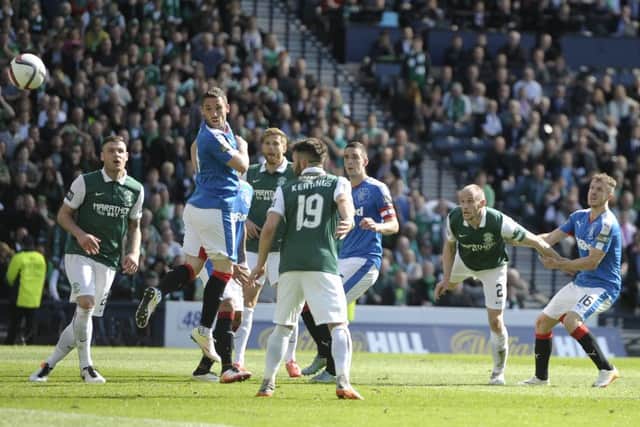 David Gray looks on as his 92nd minute header sails towards the back of the Rangers net. Picture: Neil Hanna