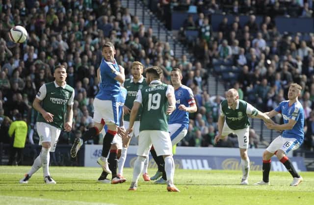 David Gray looks on as his 92nd minute header sails towards the back of the Rangers net. Picture: Neil Hanna