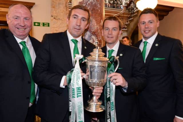 John Doolan, second right, celebrates the cup win with Andy 'Taff' Holden, Alan Stubbs and goalkeeping coach Alan Combe. Picture: SNS Group