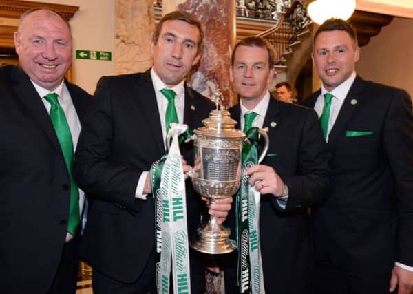 John Doolan, second right, celebrates the cup win with Andy 'Taff' Holden, Alan Stubbs and goalkeeping coach Alan Combe. Picture: SNS Group