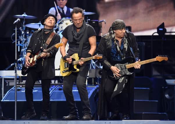US musicians Nils lofgren, Bruce Springsteen and Stevie Van Zandt perform on stage. Picture: Getty Images