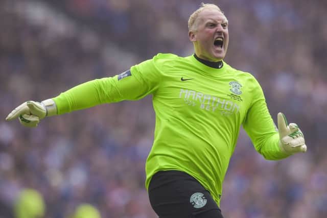 Conrad Logan celebrates Hibs opening goal on Saturday. Picture: Craig Williamson