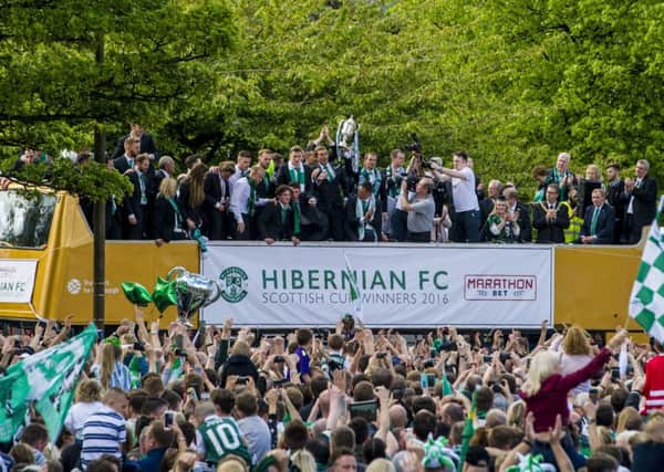 The Hibernian squad celebrate with the William Hill Scottish Cup as they parade through Edinburgh on an open-top bus. Picture: SNS