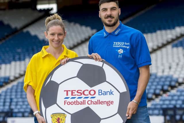 Hearts and Scoland full-back Callum Paterson and Scotland and Glasgow City's Leanne Ross show their support for the Tesco Bank Football Challenge National Festival. Picture: Bill Murray/SNS