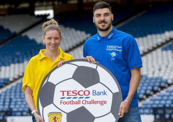 Hearts and Scoland full-back Callum Paterson  and Scotland and Glasgow City's Leanne Ross show their support for the Tesco Bank Football Challenge National Festival. Picture: Bill Murray/SNS