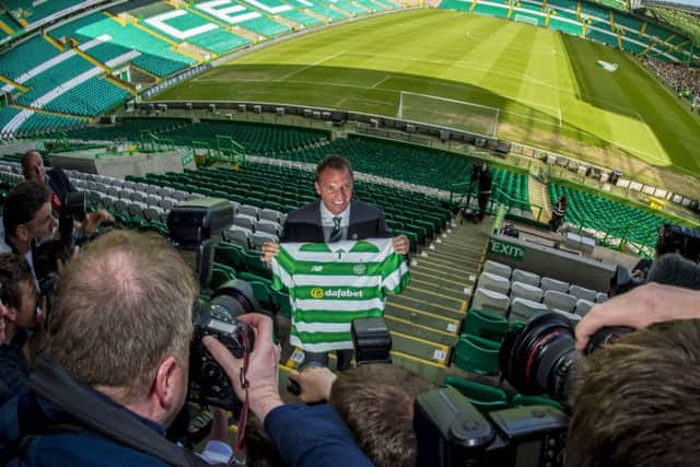Brendan Rodgers smiles for the cameras at Celtic Park yesterday. Picture: Bill Murray/SNS