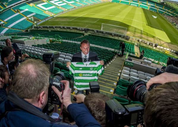 Brendan Rodgers smiles for the cameras at Celtic Park yesterday. Picture: Bill Murray/SNS