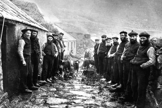 St Kilda c1890: The St Kilda 'parliament' - men meet in the village street to discuss business.