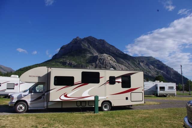 An 
RV parked among the Canadian Rockies