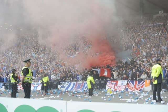 A smoke bomb goes off during the Scottish Cup Final. Picture: Greg Macvean