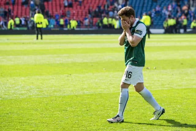 Lewis Stevenson after Hibs victory on Saturday and, left, with the League Cup nine years ago. Picture: SNS