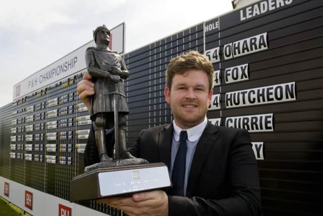 Paul O'Hara shows off the P&H Championship trophy after his victory at The Renaissance Club. Picture: Brian Stewart
