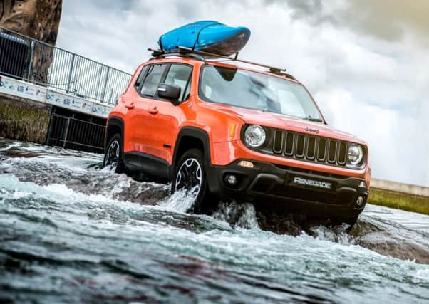 The Renegade updates the Jeeps trademark vertical grille and keeps its head  and chassis  well above water