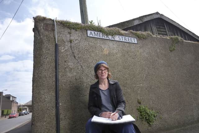 Artist, Dominique Cameron drawing in America Street, Montrose, on part of her walk through the town that informs her body of work being exhibited at the Wall Projects gallery. Picture: Gary Doak