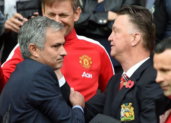 Jose Mourinho, left, is expected to be confirmed as the managerial successor to Louis van Gaal, right, at Manchester United on Friday. Picture: Martin Rickett/PA.